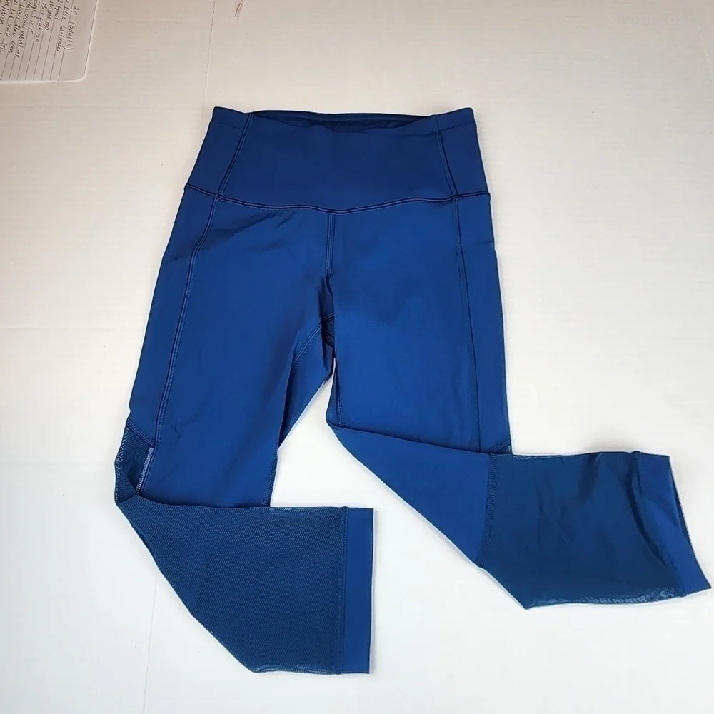 Lululemon size 2 Gear up blue Poseidon cropped leggings with sheer accents